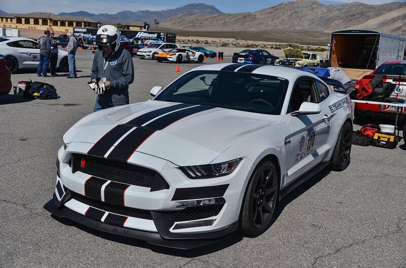 Front profile of white Shelby Mustang on track lot