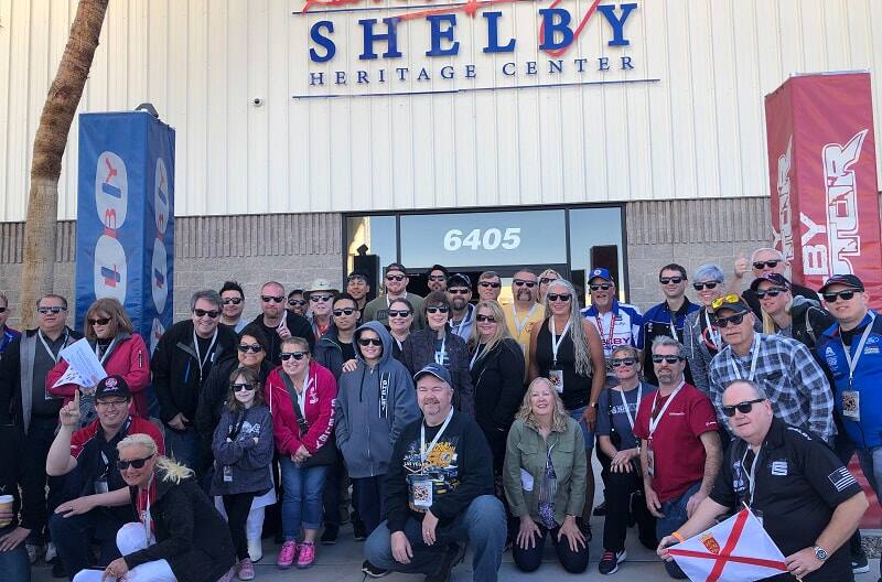 Group of people posing outside of the Shelby American Heritage Center