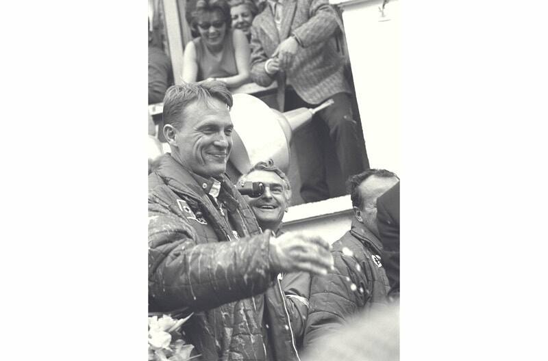 Black and white image close up of a man celebrating