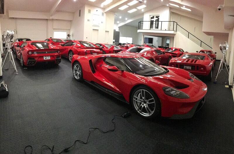 Various red Fords in a garage