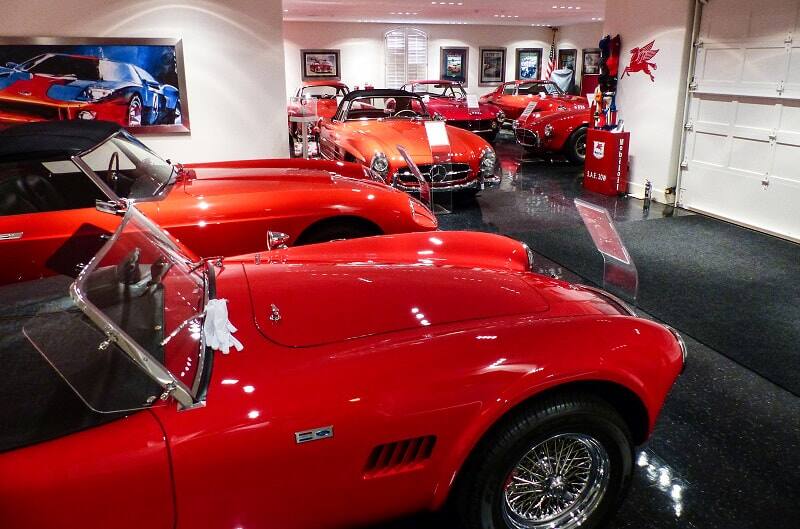 Various red Fords in a garage