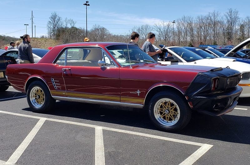 Profile of red Mustang in parking lot