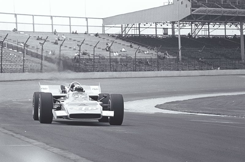 Black and white photo of indycar on the track
