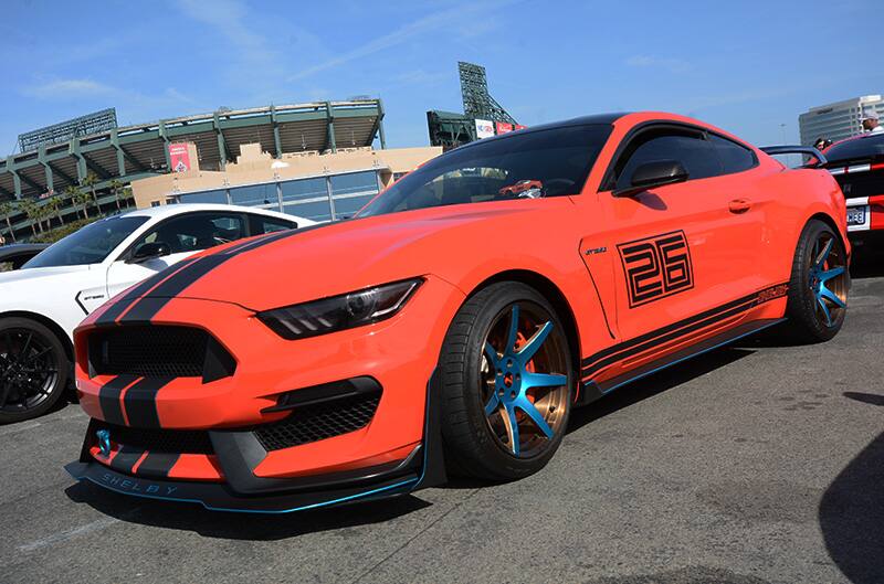 Profile of red Shelby Mustang in parking lot