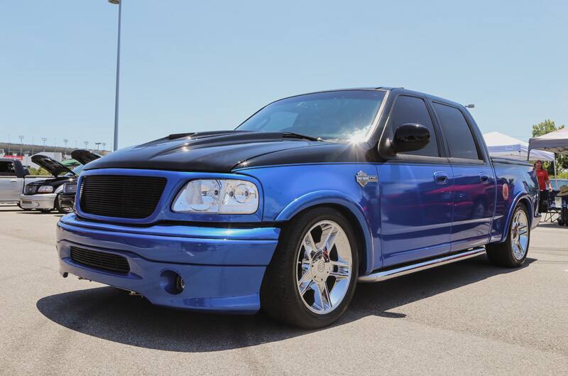 Black and blue SVT Lightning pickup in parking lot