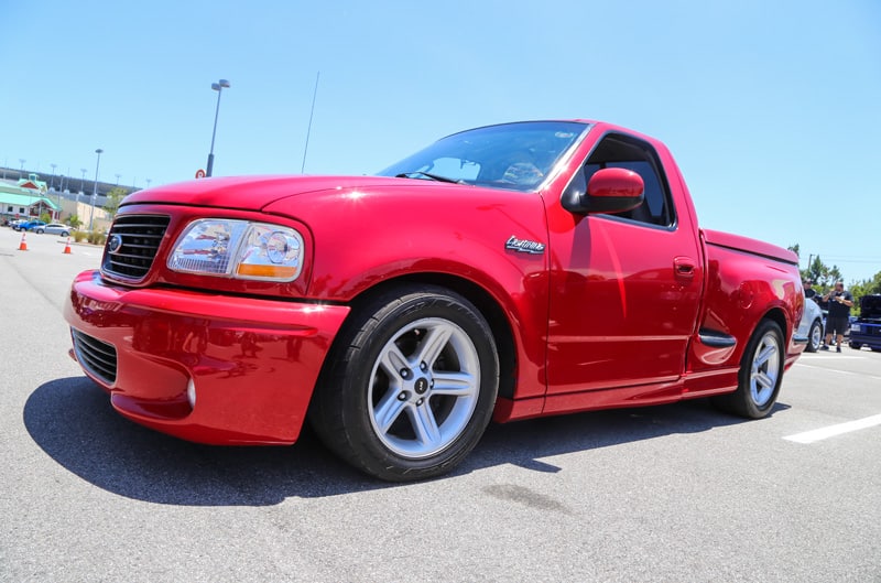Front profile of red SVT Lightning pickup in parking lot