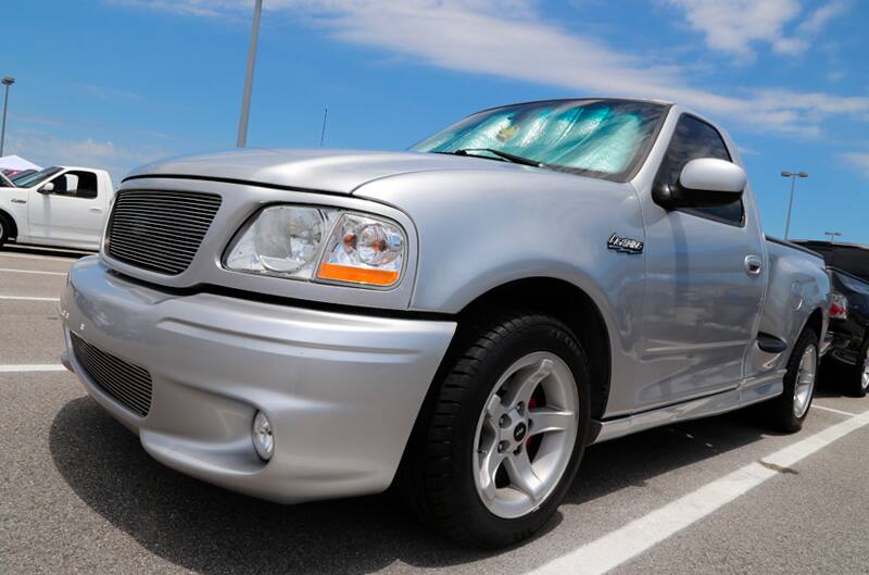 Front profile of silver SVT Lightning in parking lot