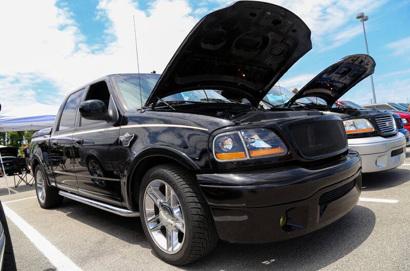 Front profile of black SVT Lightning in parking lot