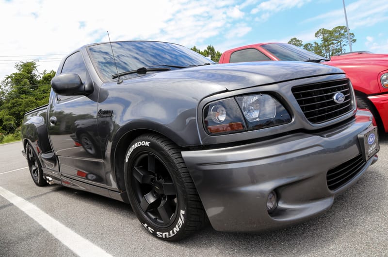 Front profile of dark gray SVT Lightning in parking lot