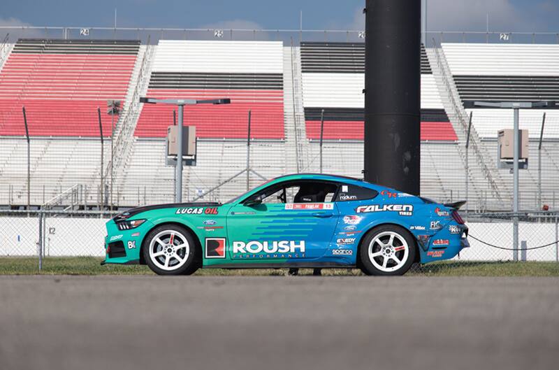 Profile of Justin Pawlaks green and blue Mustang