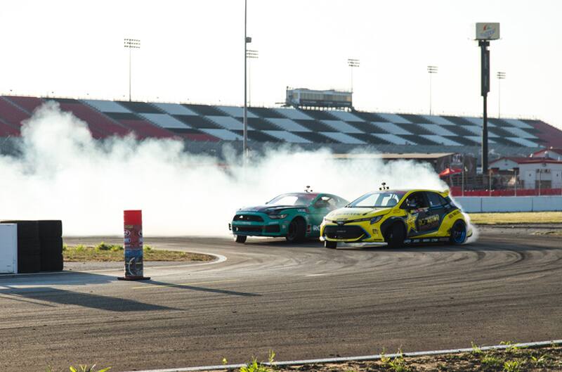 Two Fords drifting on the track