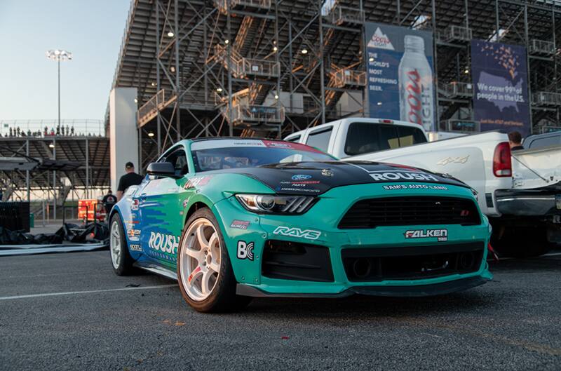 Front of Justin Pawlaks blue and green Mustang in parking lot