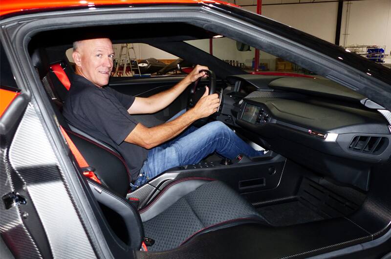 Profile from passenger side of Justin Gurney in driver seat of GT