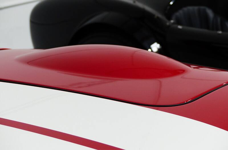 Close up of the hood of the red GT with white stripes