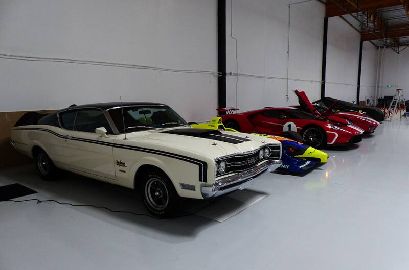 Various Fords parked in a garage