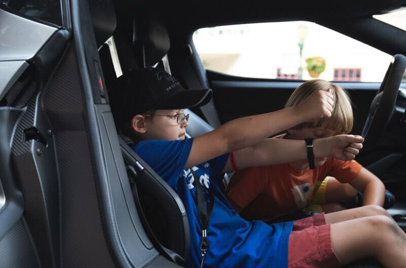 Patch Hurty and his younger brother in the front seat of a Ford truck