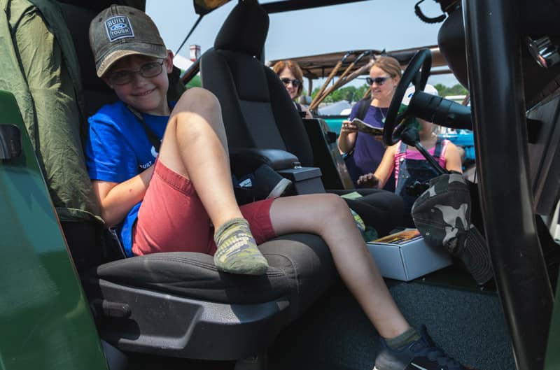 Patch Hurty sitting in the front seat of a Ford vehicle