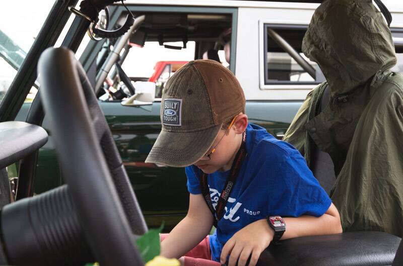 Patch Hurty sitting in the front seat of a Ford vehicle