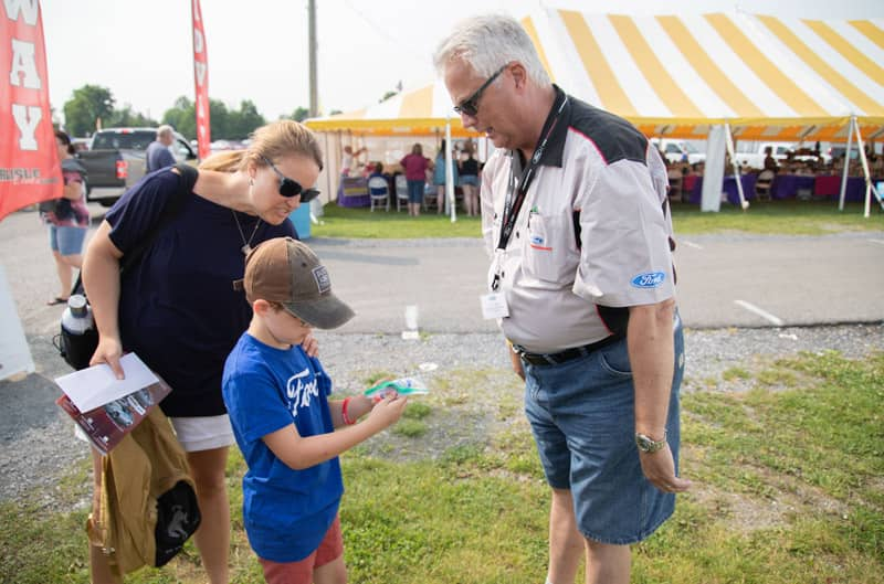 Patch Hurty receiving a gift from a Ford fan