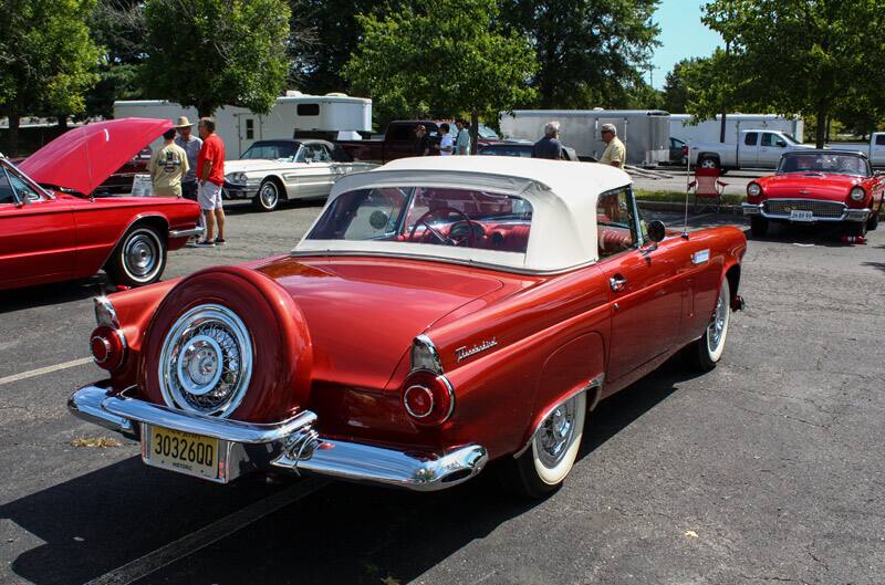 Interior shot from passenger side of all red front seat