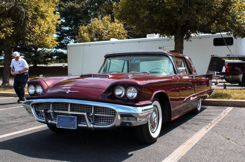 Front profile of red Thunderbird in parking lot