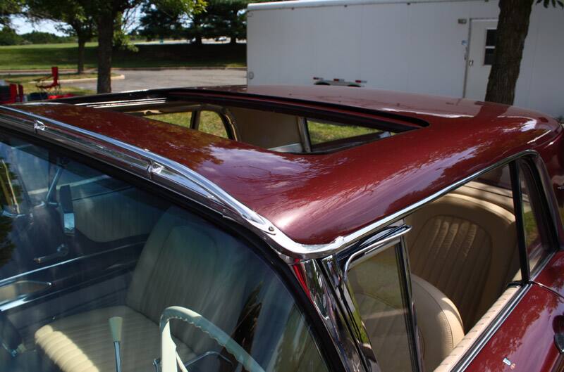 Close up of open sun roof of red Thunderbird