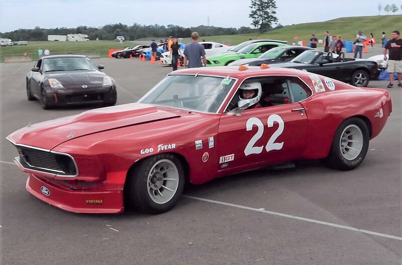 Profile of red Mustang Boss in parking lot