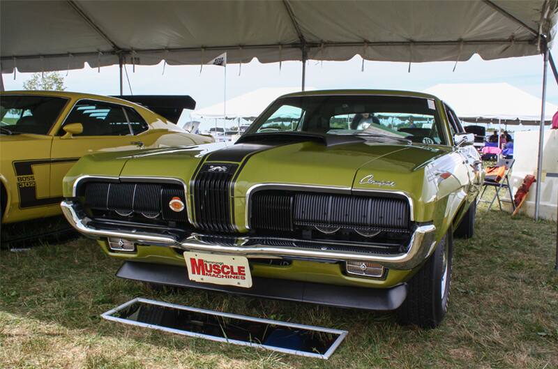 Front of green Mustang Boss parked under hood