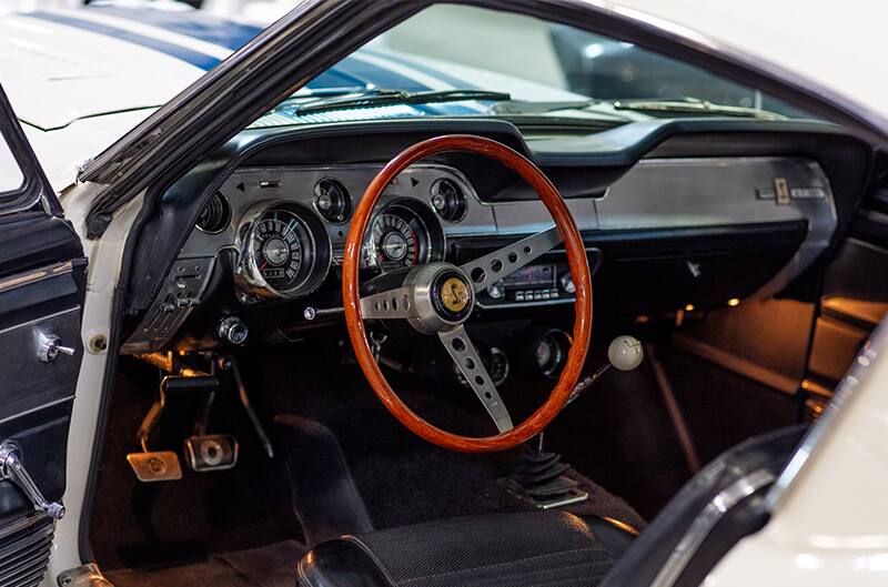 Interior close up of front seat steering wheel from driver side