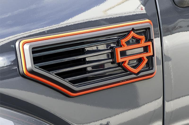 Close up of Harley Davidson logo on side of Gray F150></p>
<p>Approximately 70,000 trucks have been sold under the highly successful Ford F-Series Harley-Davidson Edition program from 2000 through 2012 (see sidebar below). Most recently, <a href=