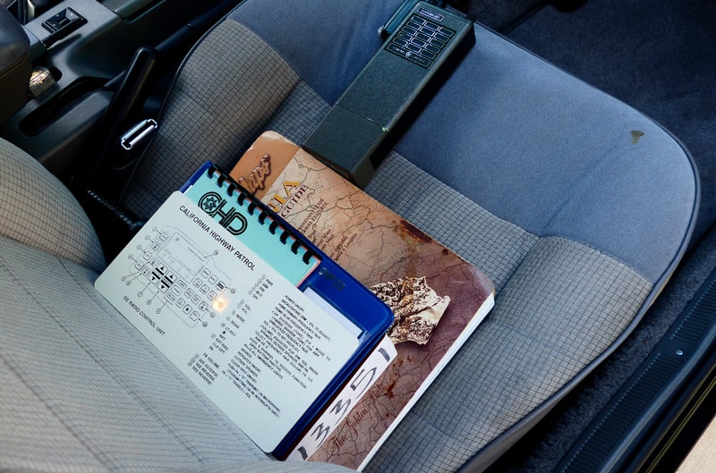 Interior shot of passenger seat with books on the seat