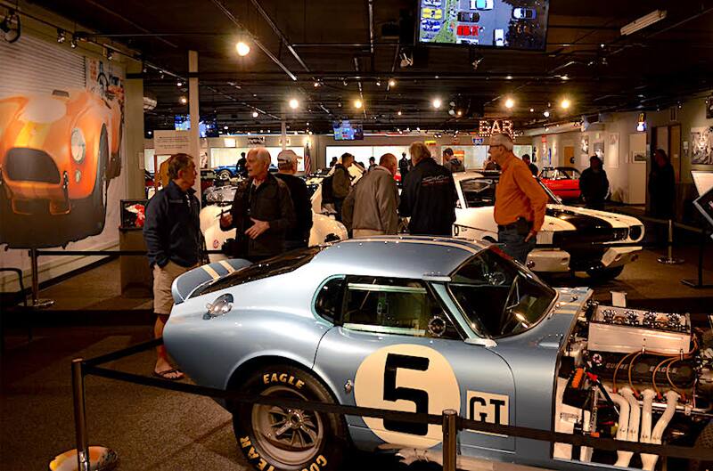 Profile of blue Shelby Cobra GT on display in museum