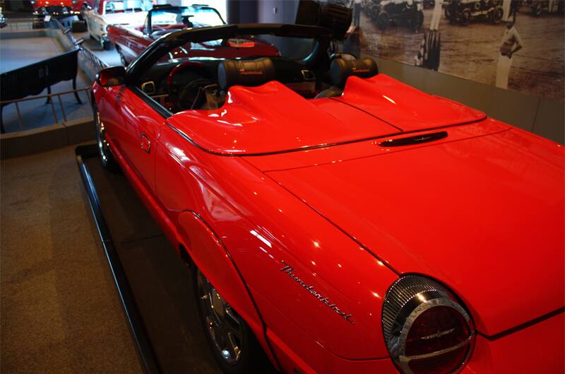 Rear of a red Thunderbird droptop with roof down on display