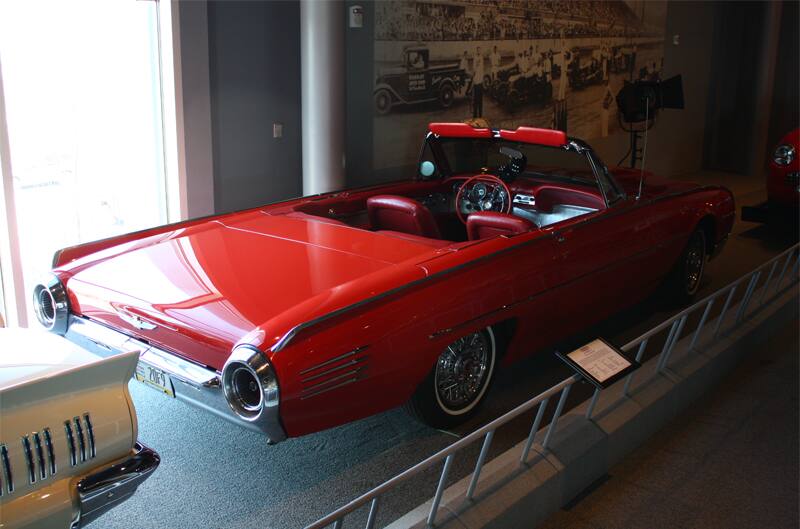 Rear of red Thunderbird droptop with roof down on display