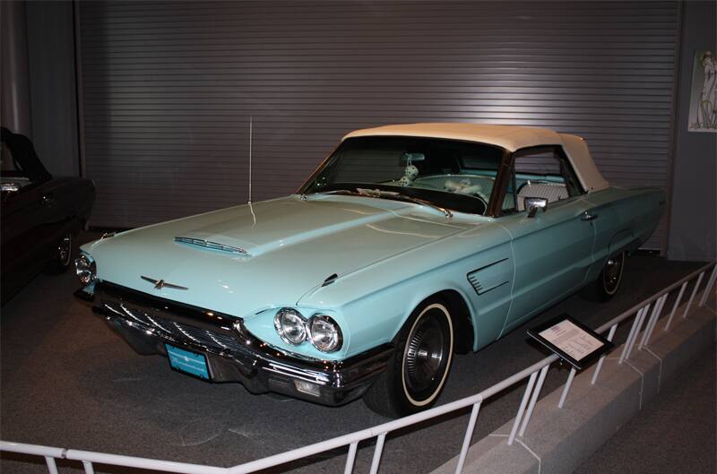 Front of teal blue Thunderbird droptop with white roof on display