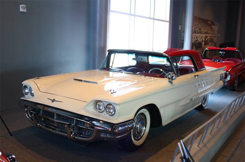 Front profile of white Thunderbird with red roof on display