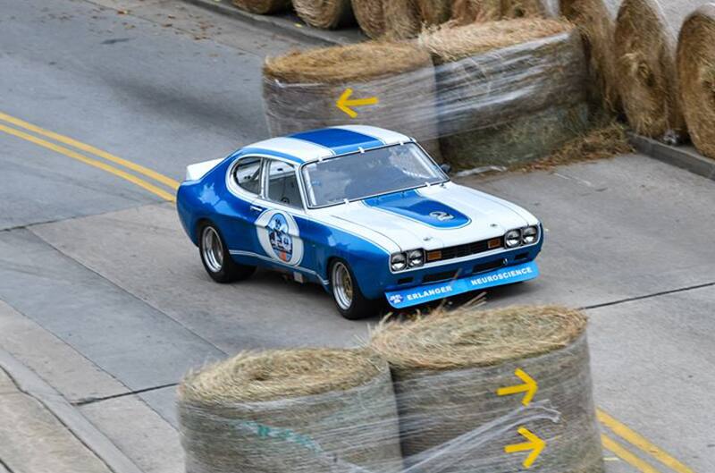 Overhead shot of blue Capri driving on the track