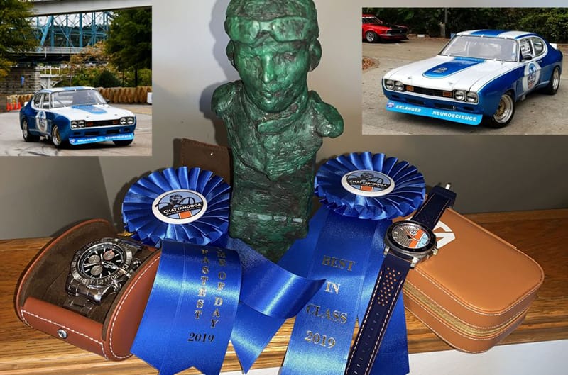 Close up of two blue ribbons with two pictures of the blue Capri