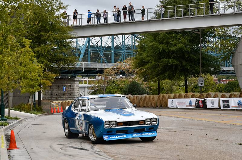 Front of blue Capri on the track