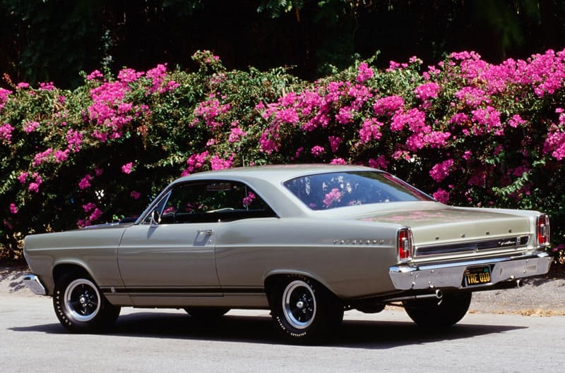 Rear profile of white Fairlane GTA parked on the road