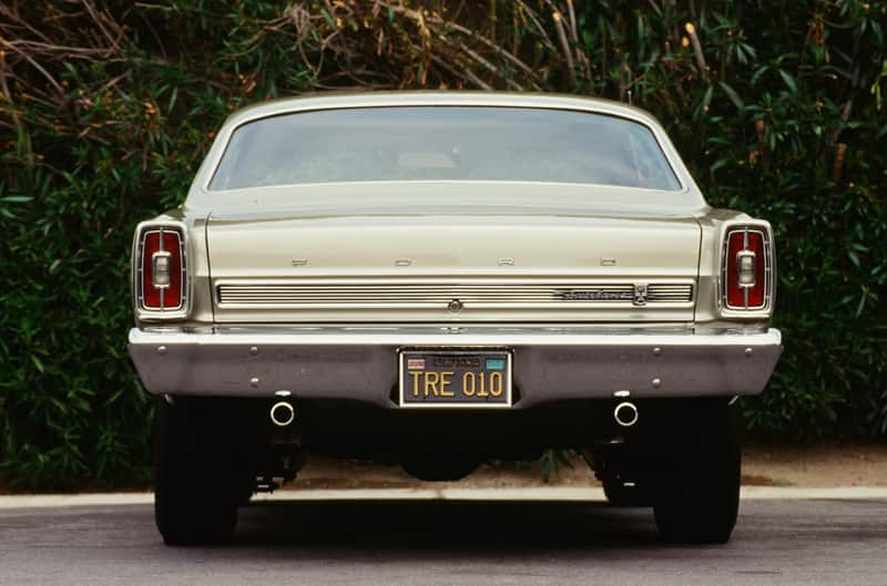 Rear of white Fairlane GTA parked in lot