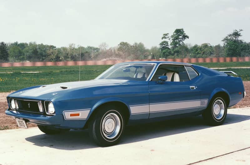 Front profile of blue Mach 1 in driveway