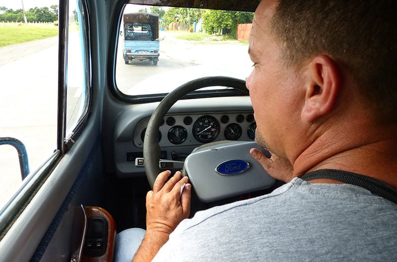 Cuban Driver pilots antique Ford called Blue Whale