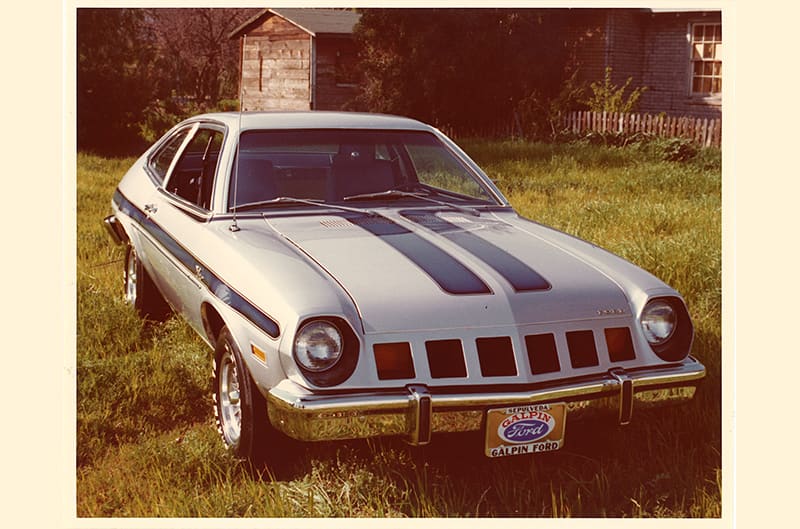 aged photo of silver and blue mustang II Major