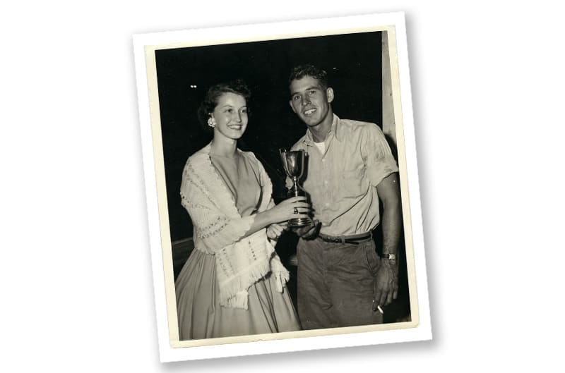Black and white photo of David and woman holding trophy