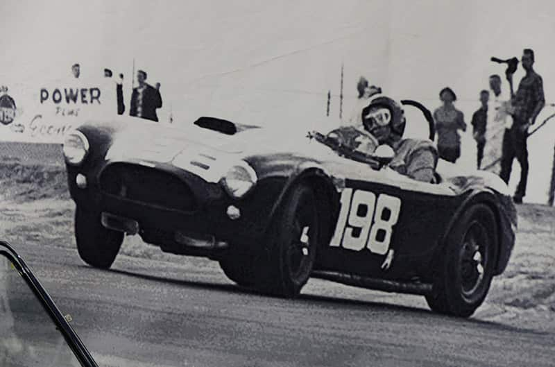 Dave McDonald driving Cobra 198 black and white historic photo