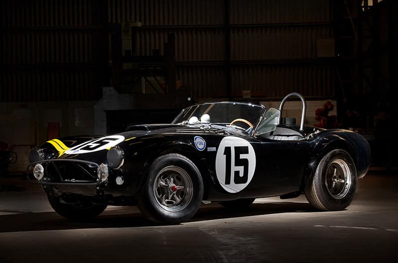 Black Shelby Cobra with dark background number 15