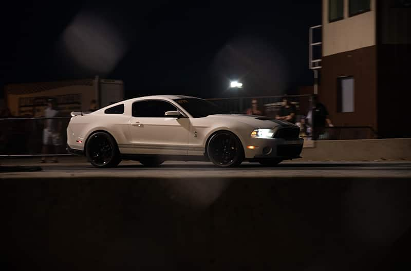 White 2012 GT500 at the start line of drag strip