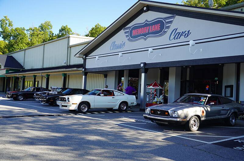 Mustang II's lined up outside of building