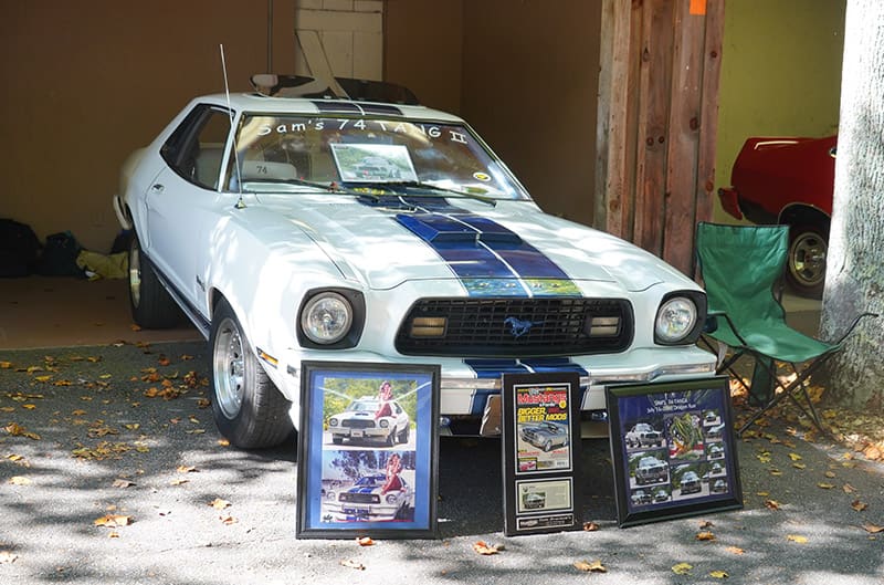 White Mustang II on display with awards placed in front